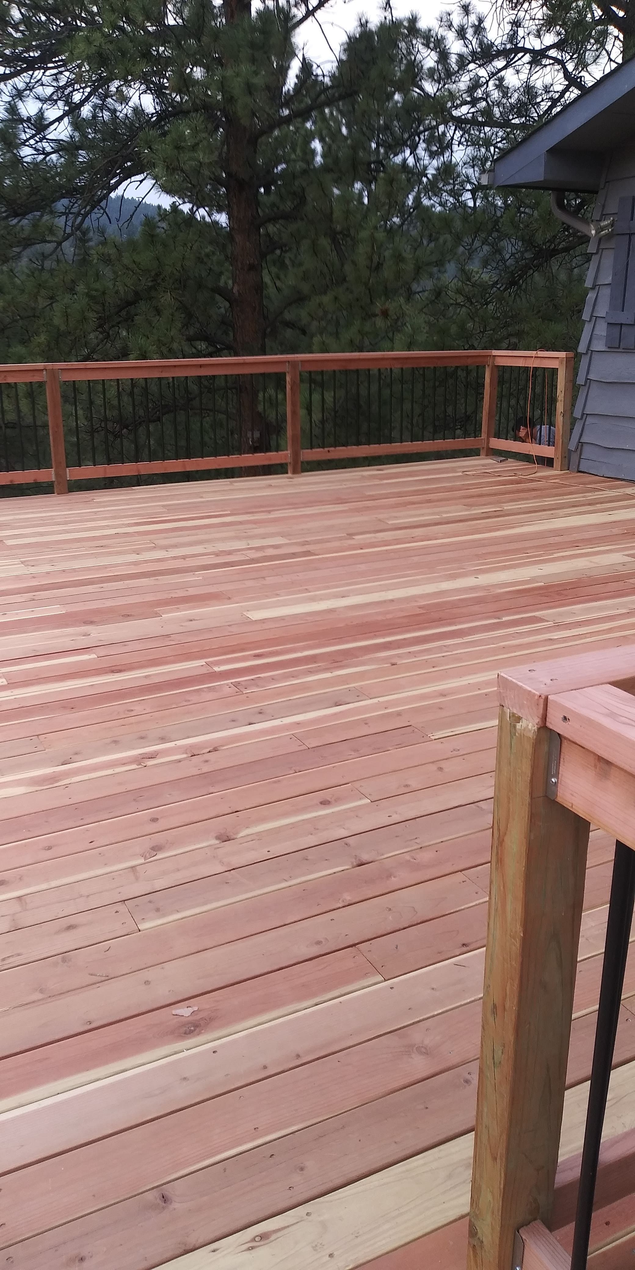 Picture of a newly installed deck and railings in a backyard in portland, Oregon